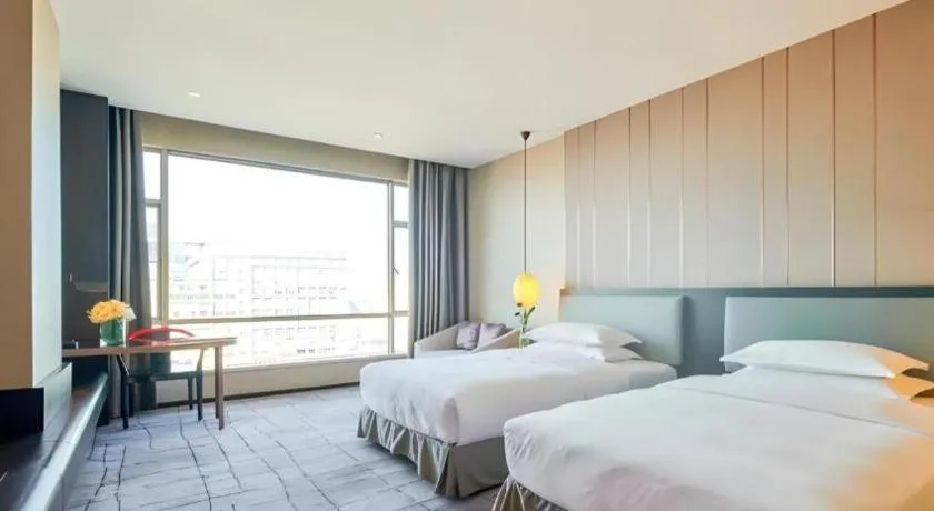 Bed in DongGuan JOYC Hotel 