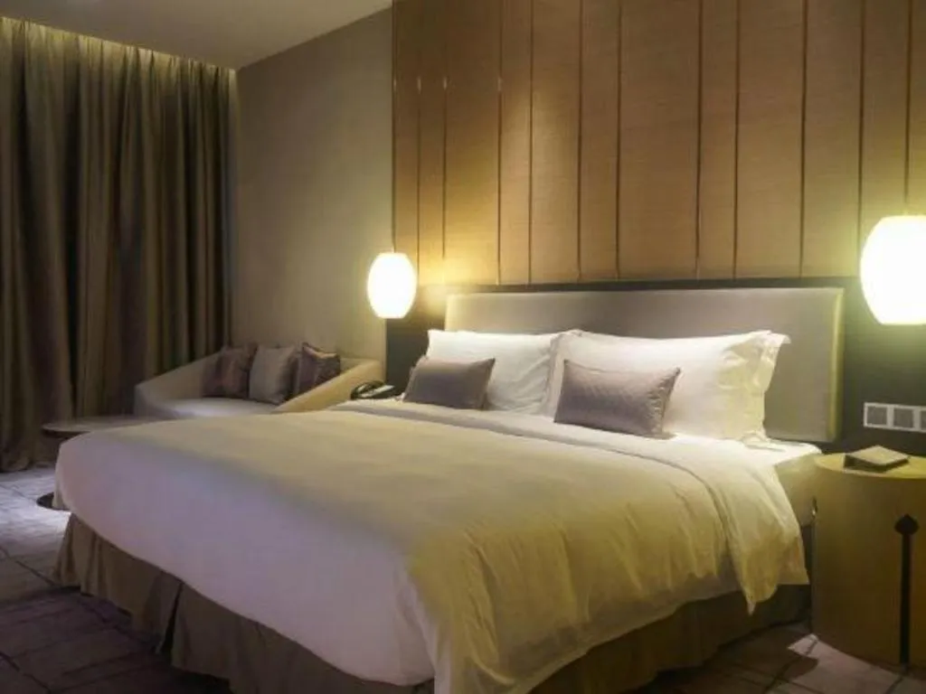 Bed in DongGuan JOYC Hotel 