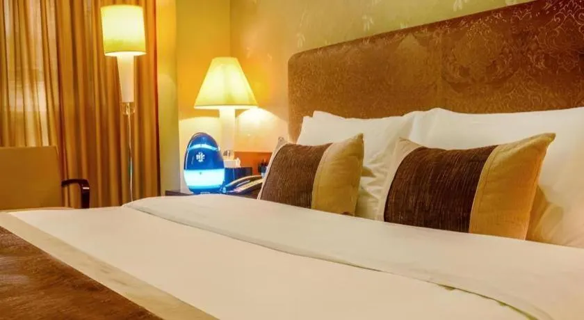 Bed in Eurasia International Hotel