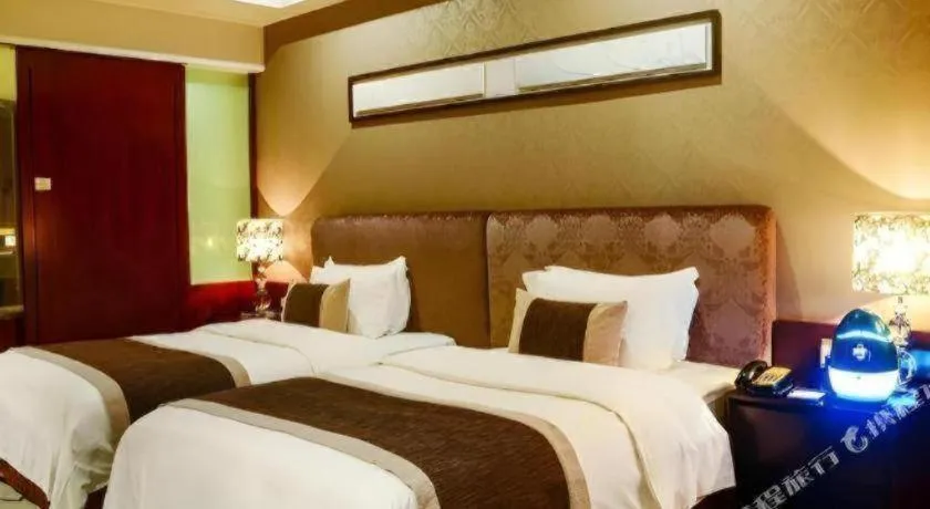 Bed in Eurasia International Hotel