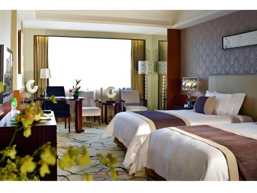 Bed in Eurasia International Hotel