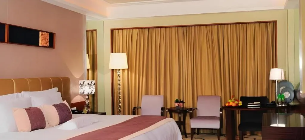 Bed in Eurasia International Hotel