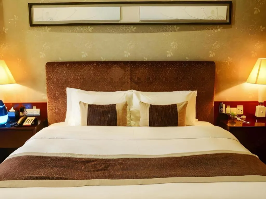 Bed in Eurasia International Hotel