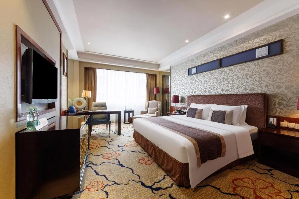 Bed in Eurasia International Hotel