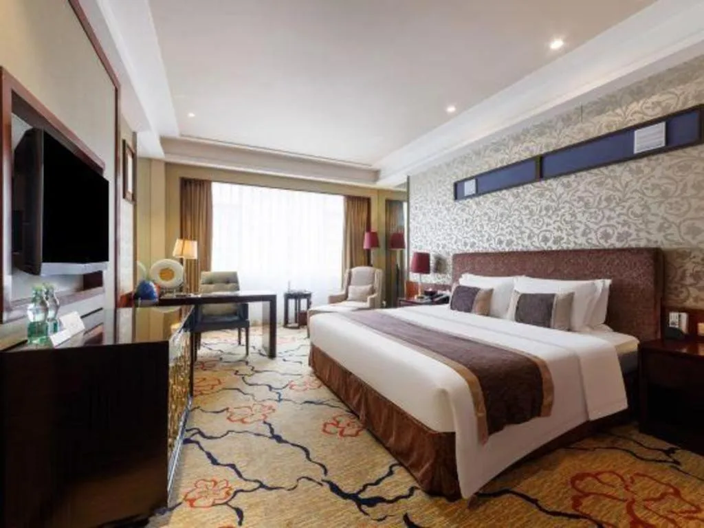 Bed in Eurasia International Hotel