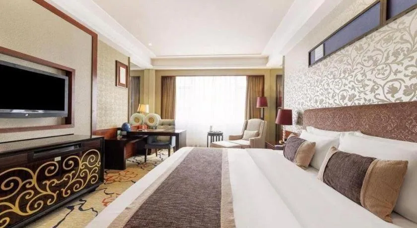 Bed in Eurasia International Hotel