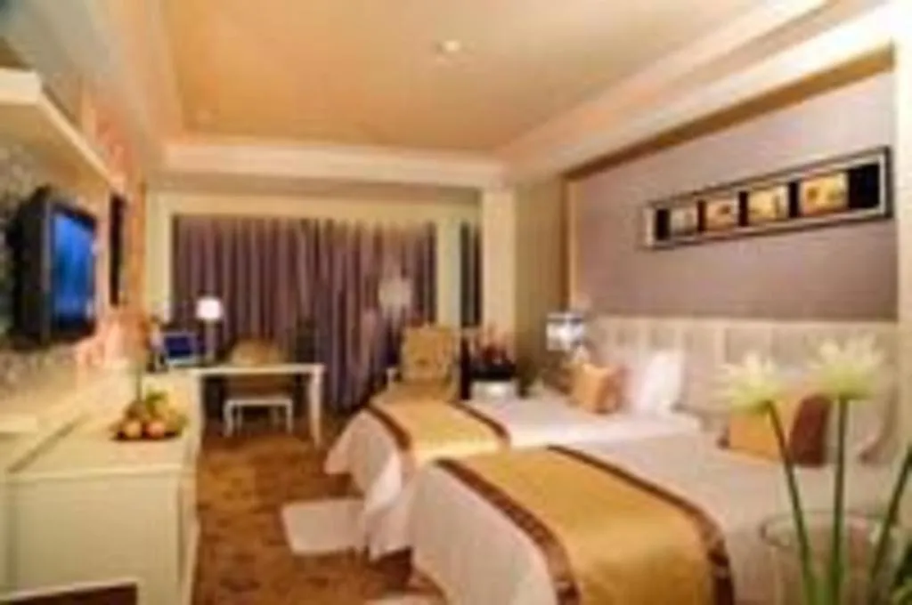Bed in Eurasia International Hotel