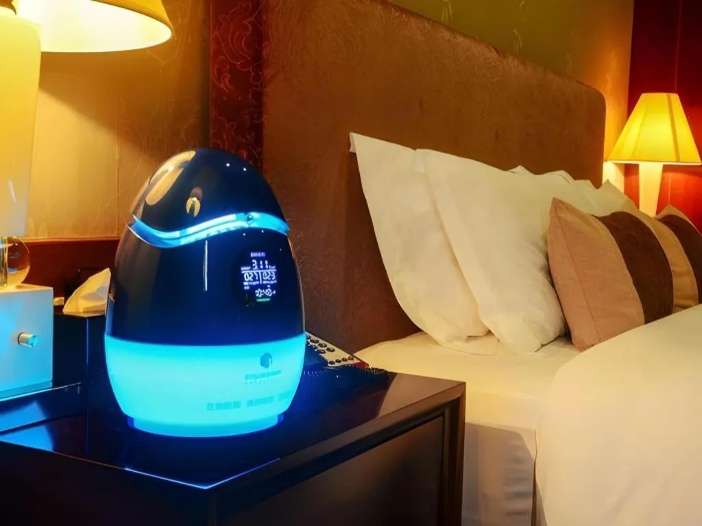 Bed in Eurasia International Hotel