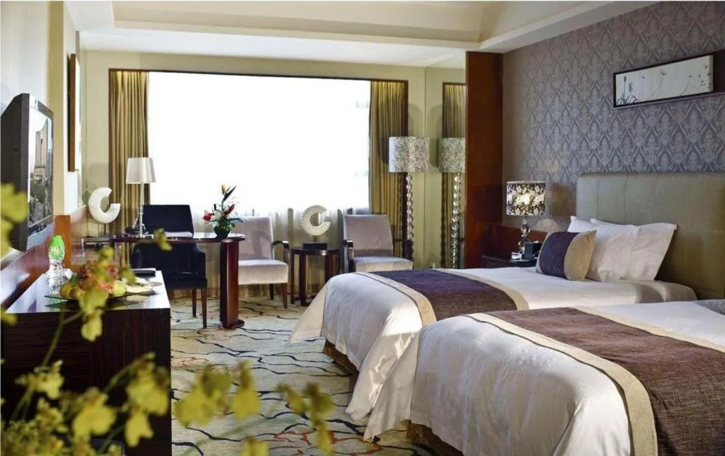 Bed in Eurasia International Hotel