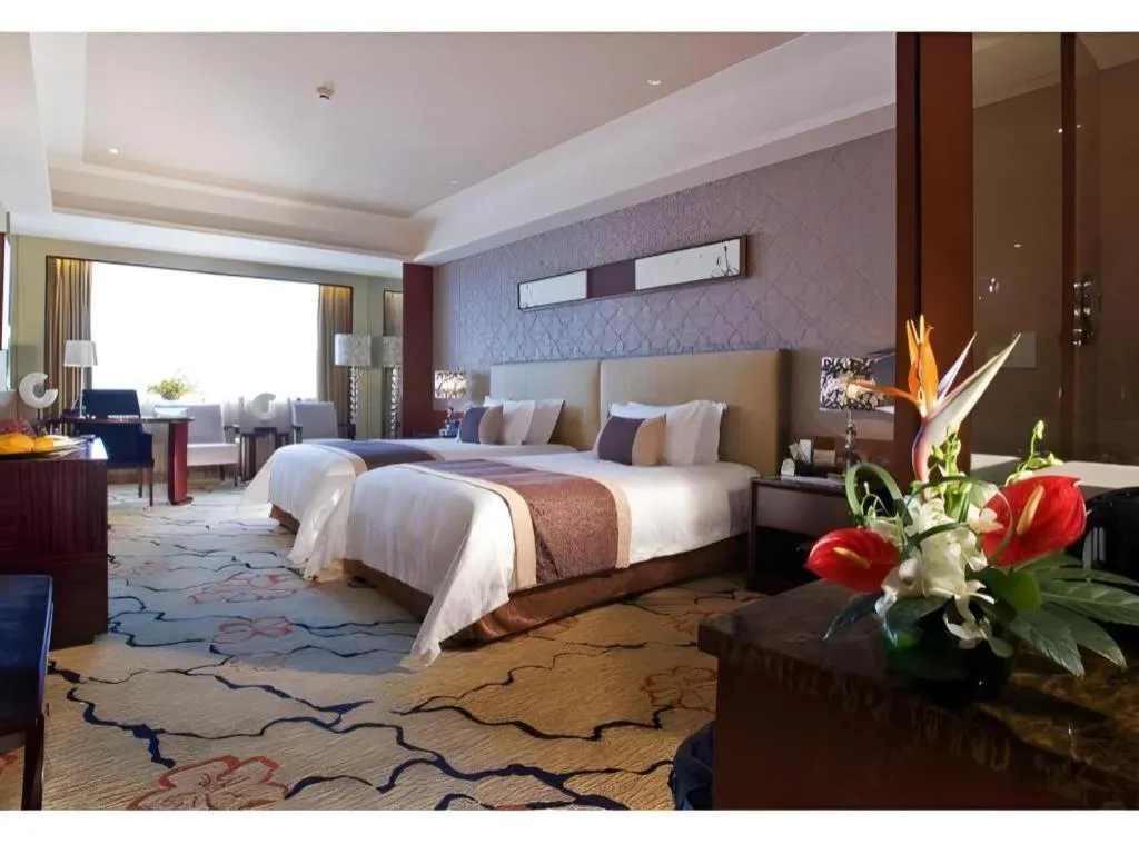 Bed in Eurasia International Hotel