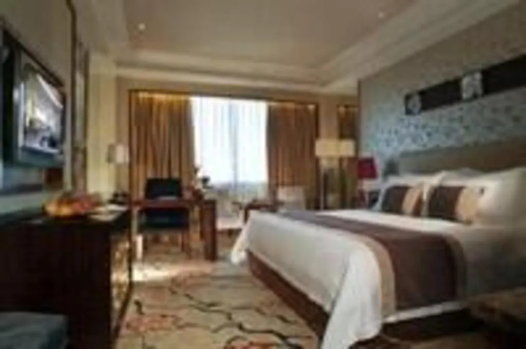 Bed in Eurasia International Hotel