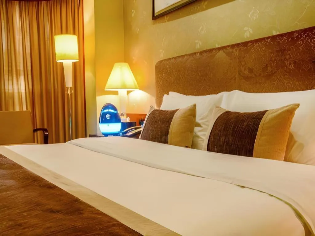 Bed in Eurasia International Hotel