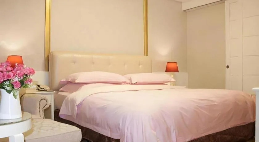 Bed in Eurasia International Hotel