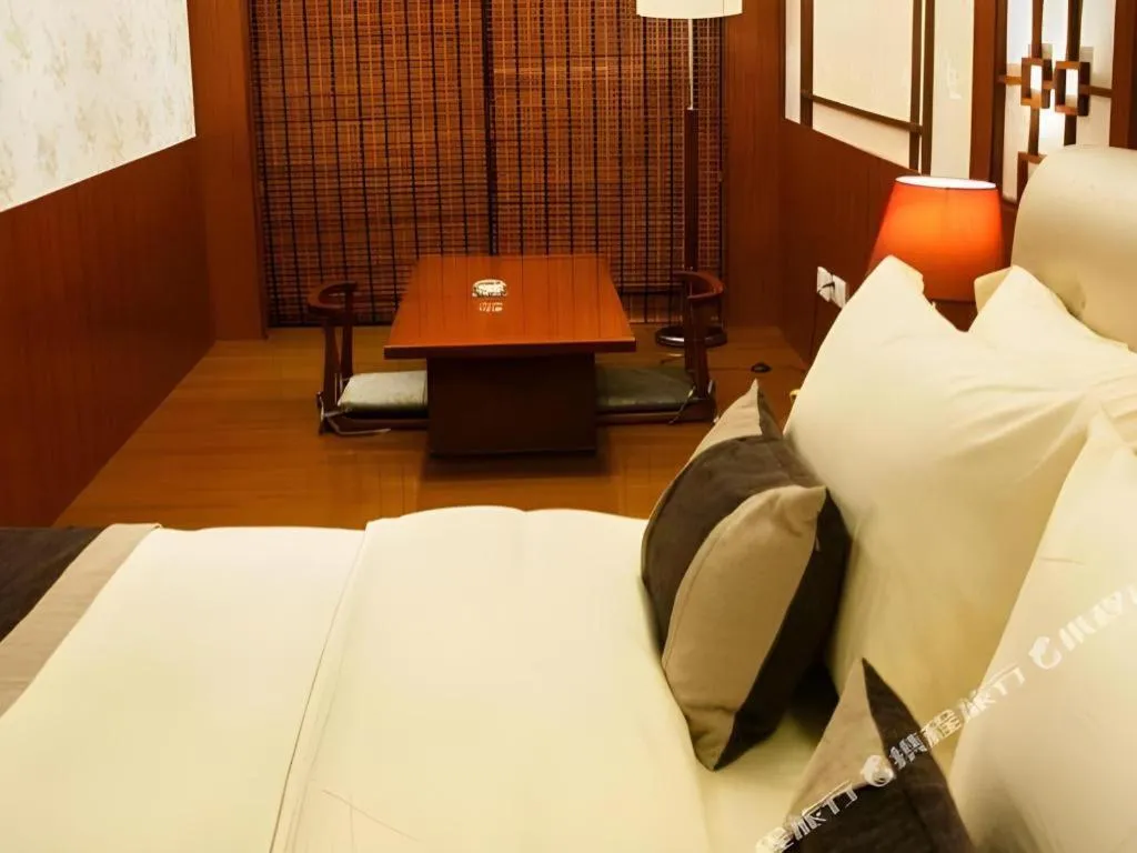 Bed in Eurasia International Hotel