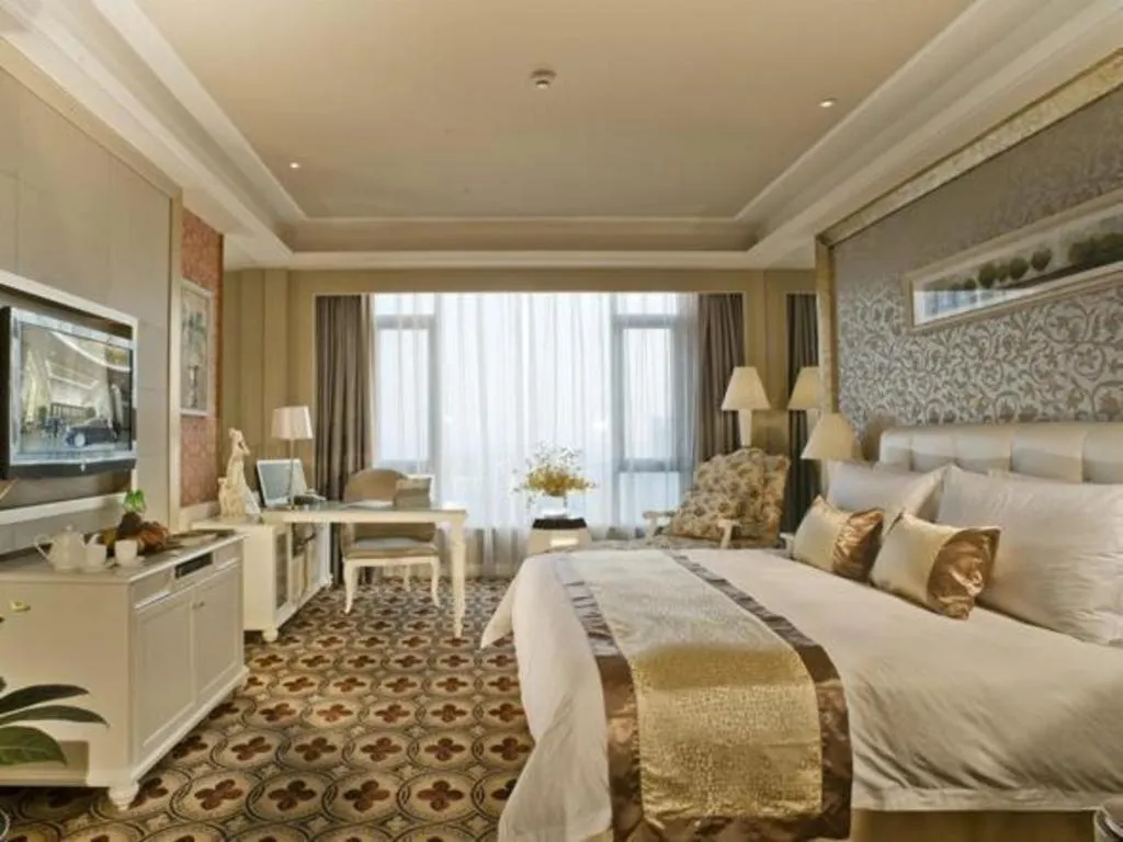 Bed in Eurasia International Hotel
