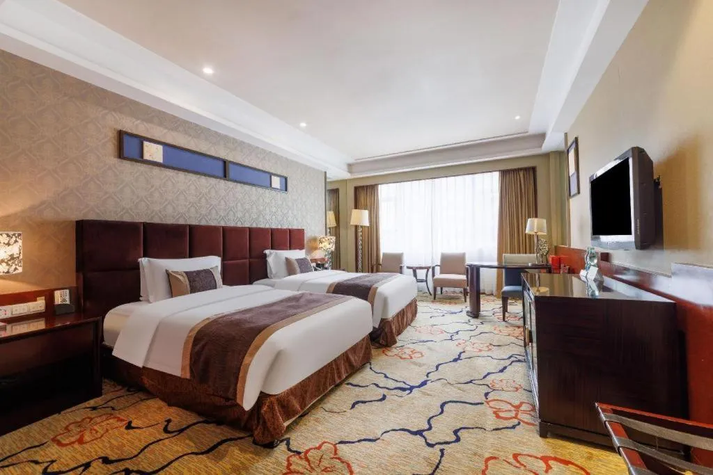 Bed in Eurasia International Hotel