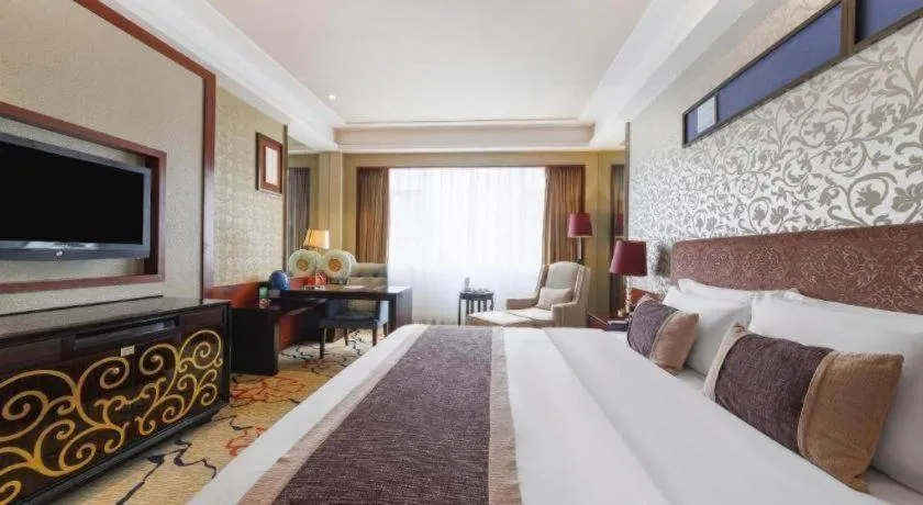 Bed in Eurasia International Hotel