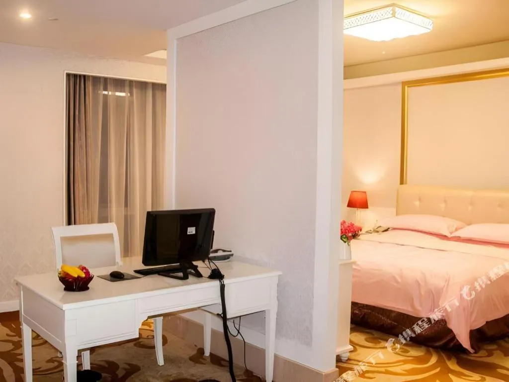 Bed in Eurasia International Hotel