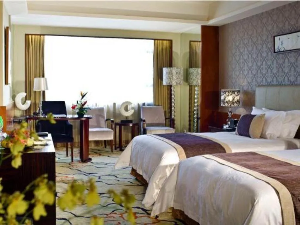 Bed in Eurasia International Hotel