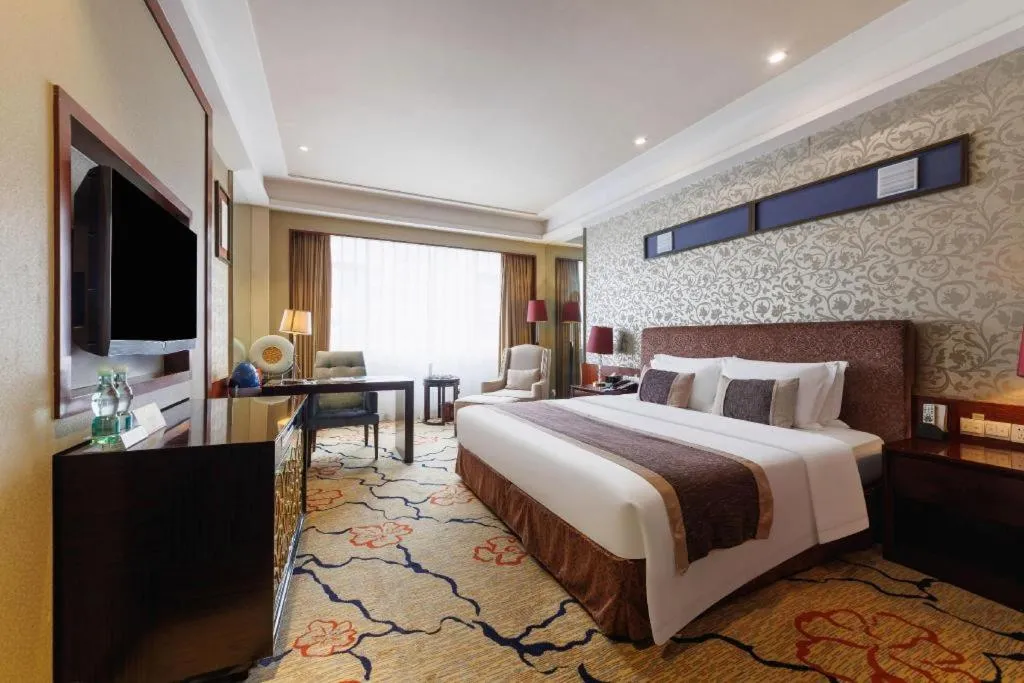 Bed in Eurasia International Hotel