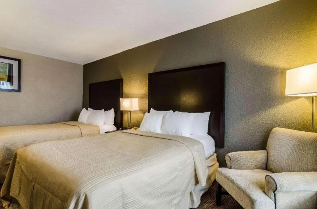 Bed in Quality Inn & Suites