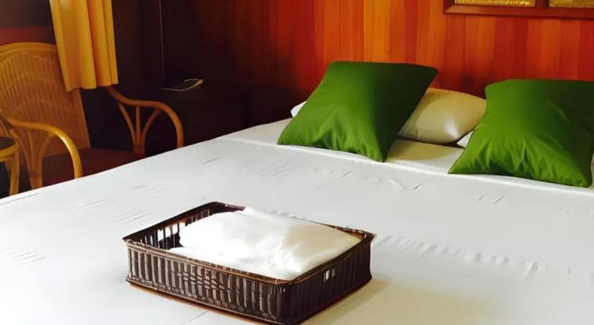 Bed in Chiangsan Goldenland Resort