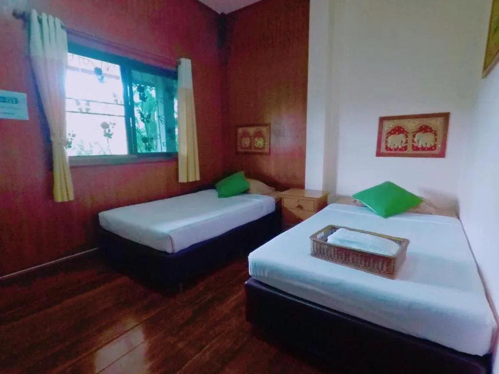 Bed in Chiangsan Goldenland Resort