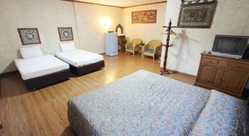 Bed in Chiangsan Goldenland Resort