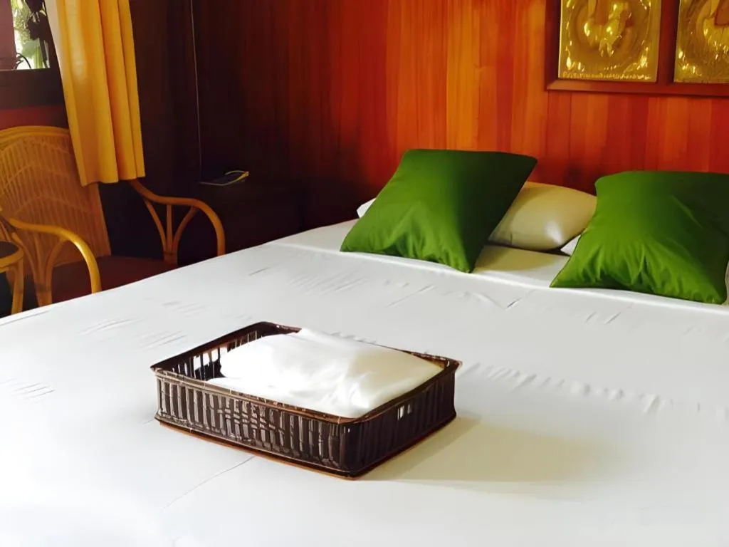 Bed in Chiangsan Goldenland Resort