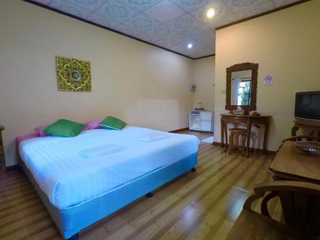Bed in Chiangsan Goldenland Resort