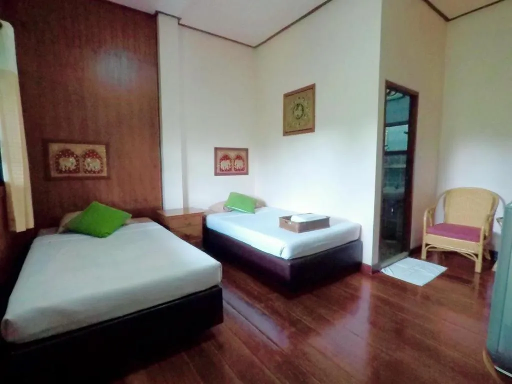 Bed in Chiangsan Goldenland Resort