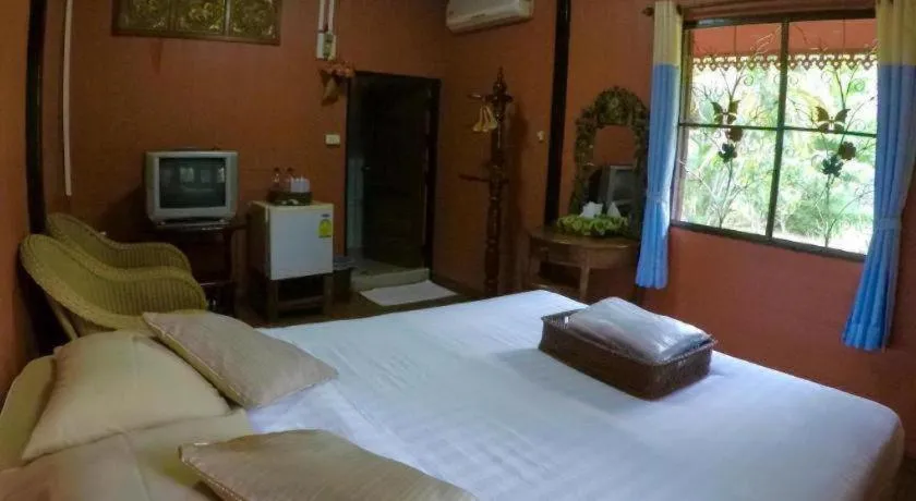 Bed in Chiangsan Goldenland Resort