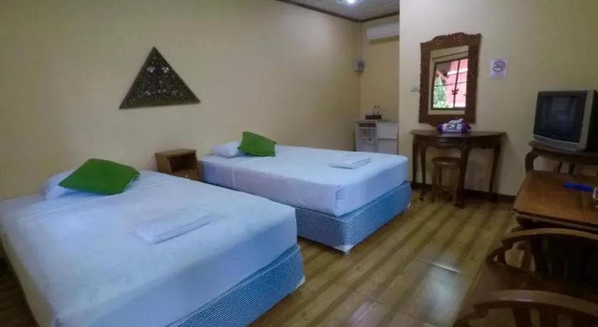 Bed in Chiangsan Goldenland Resort