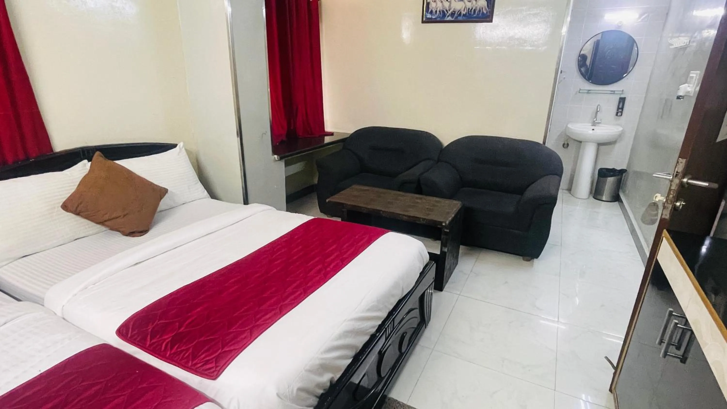 Bed in Hotel Sai Palace Inn