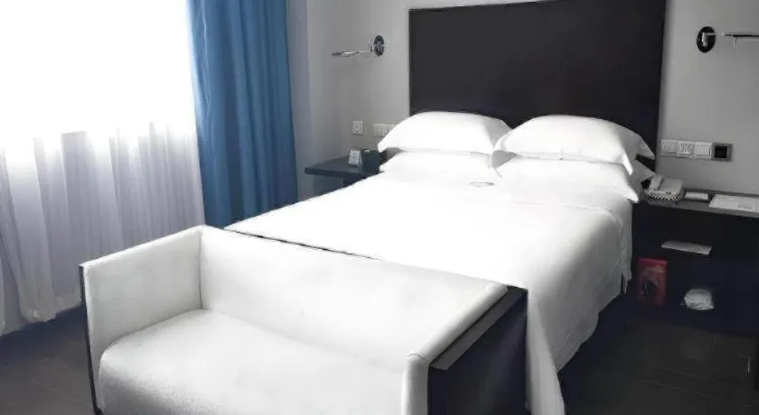 Bed in Guangdong Nanmei Osotto Hotel