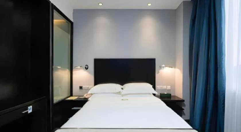 Bed in Guangdong Nanmei Osotto Hotel