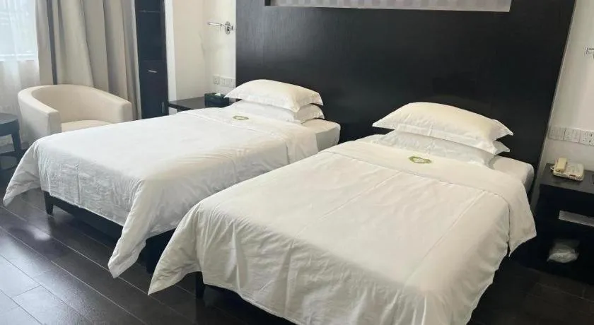 Bed in Guangdong Nanmei Osotto Hotel