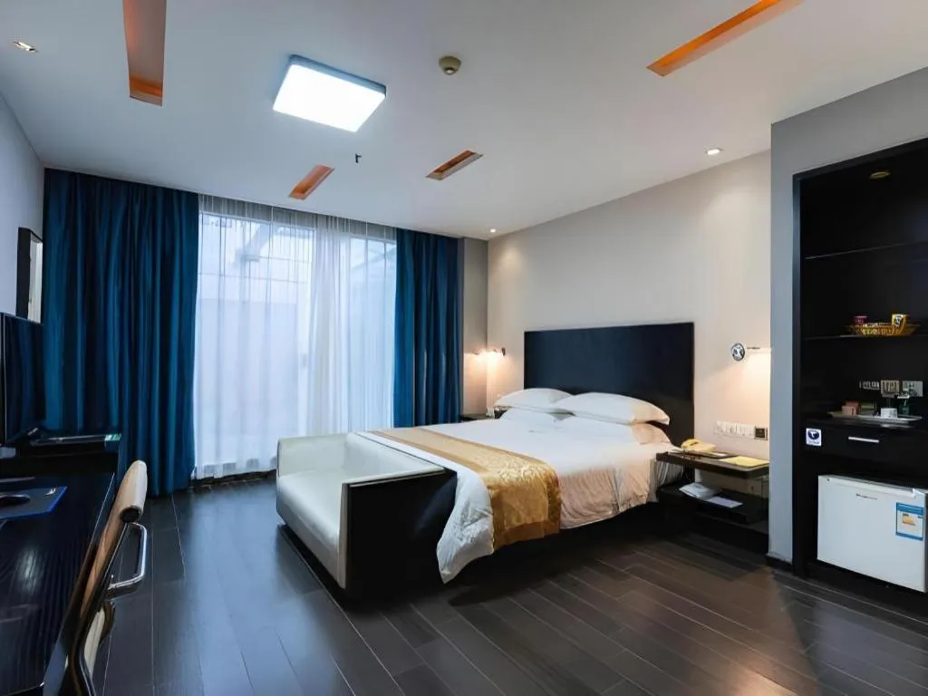 Bed in Guangdong Nanmei Osotto Hotel