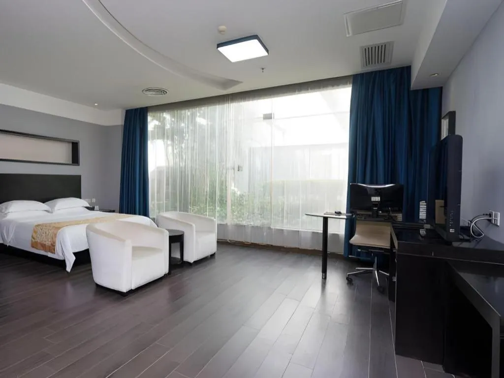 Bed in Guangdong Nanmei Osotto Hotel