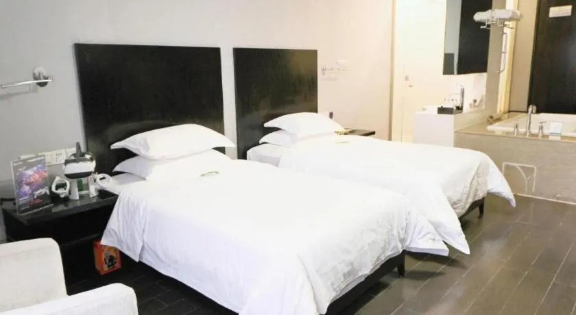 Bed in Guangdong Nanmei Osotto Hotel