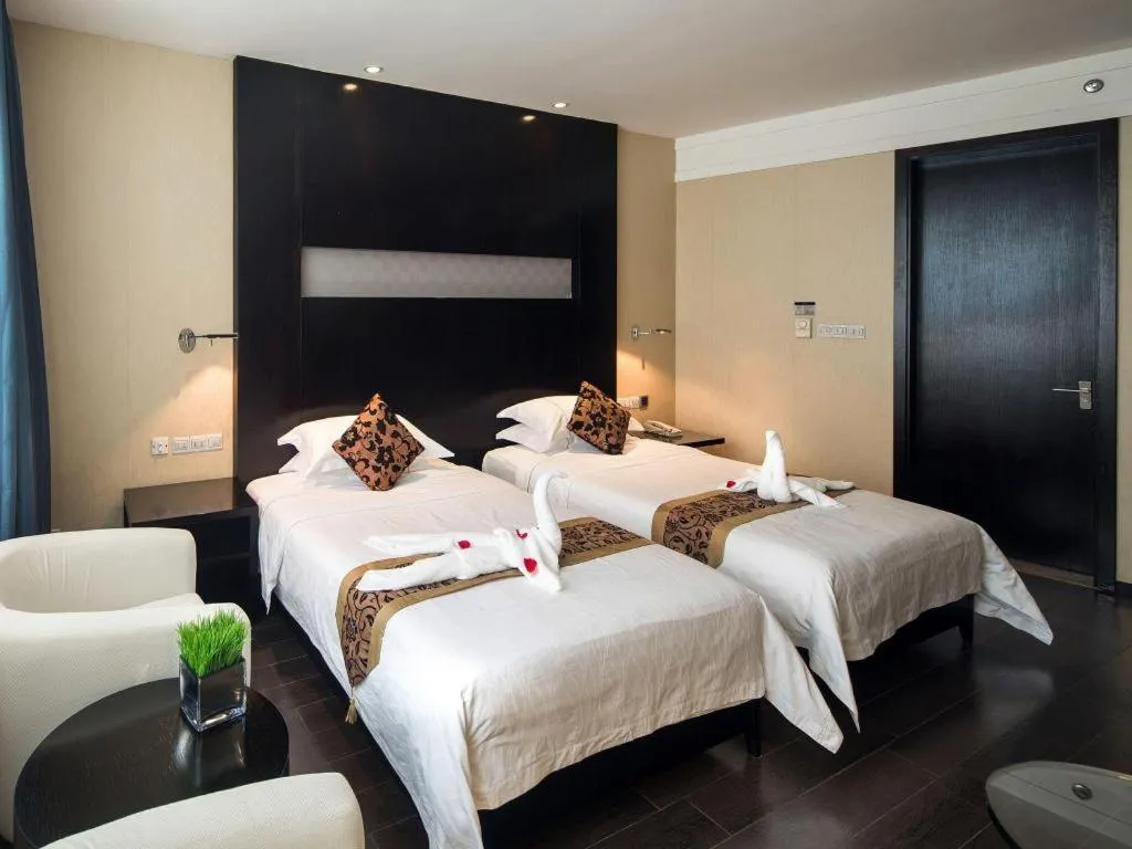 Bed in Guangdong Nanmei Osotto Hotel