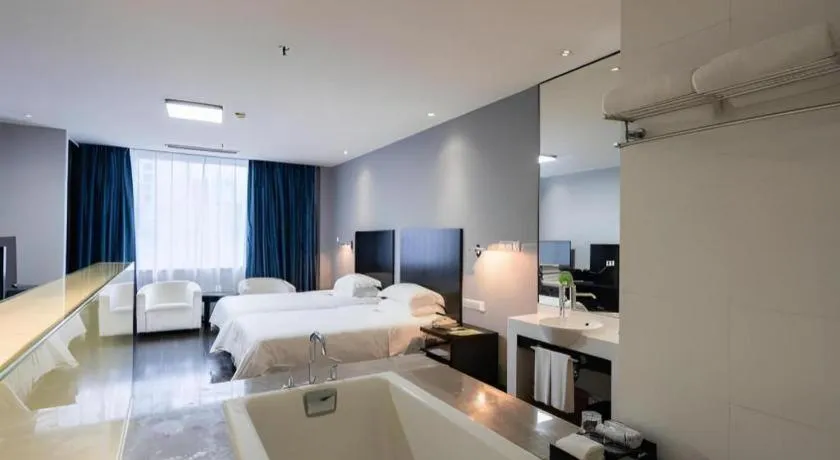 Bed in Guangdong Nanmei Osotto Hotel