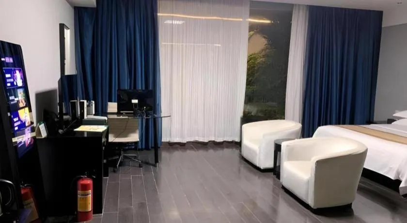 Bed in Guangdong Nanmei Osotto Hotel