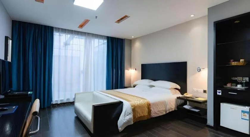 Bed in Guangdong Nanmei Osotto Hotel