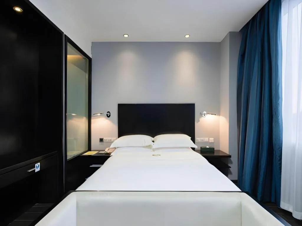 Bed in Guangdong Nanmei Osotto Hotel