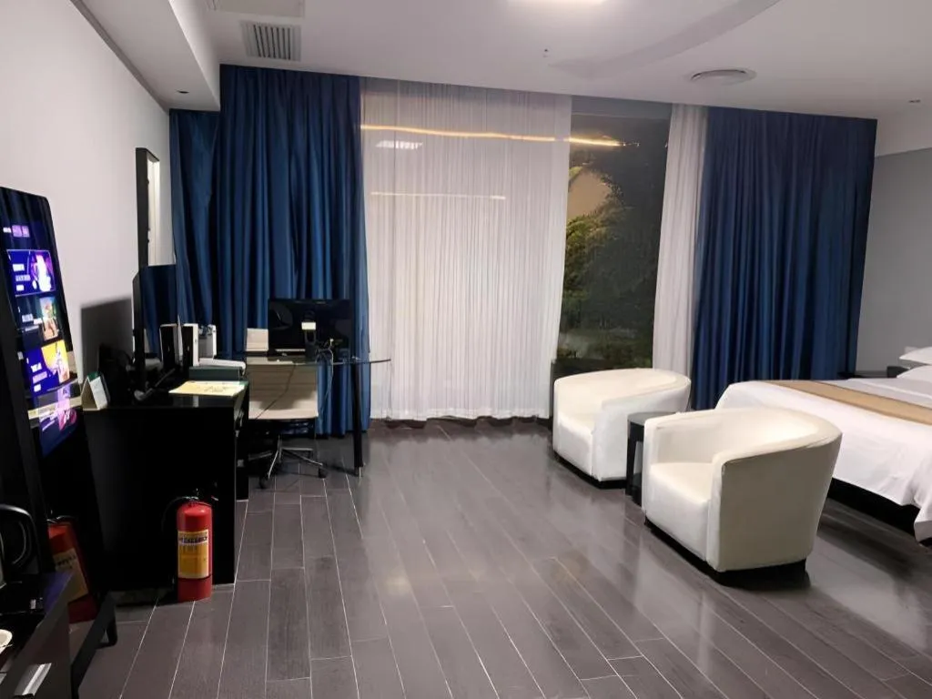 Bed in Guangdong Nanmei Osotto Hotel