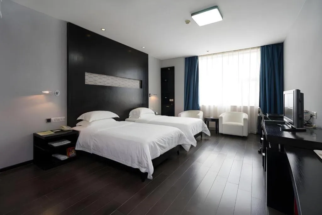 Bed in Guangdong Nanmei Osotto Hotel