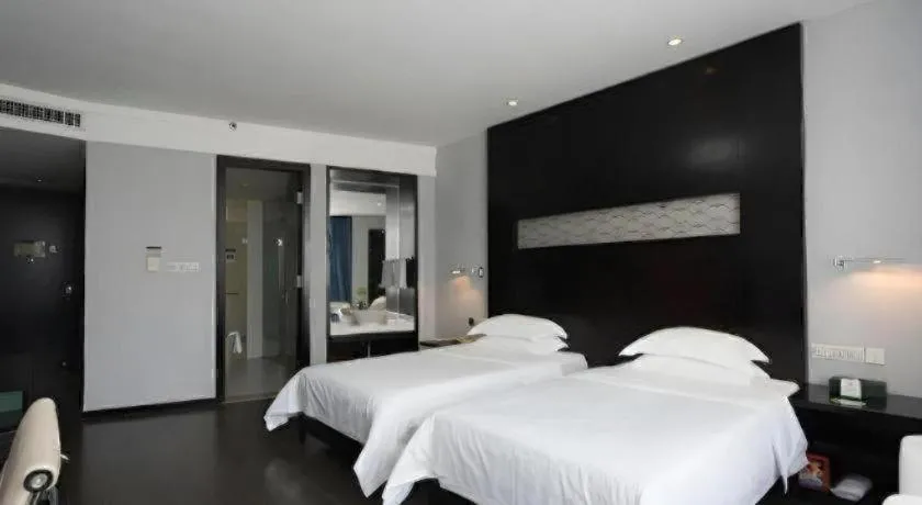 Bed in Guangdong Nanmei Osotto Hotel