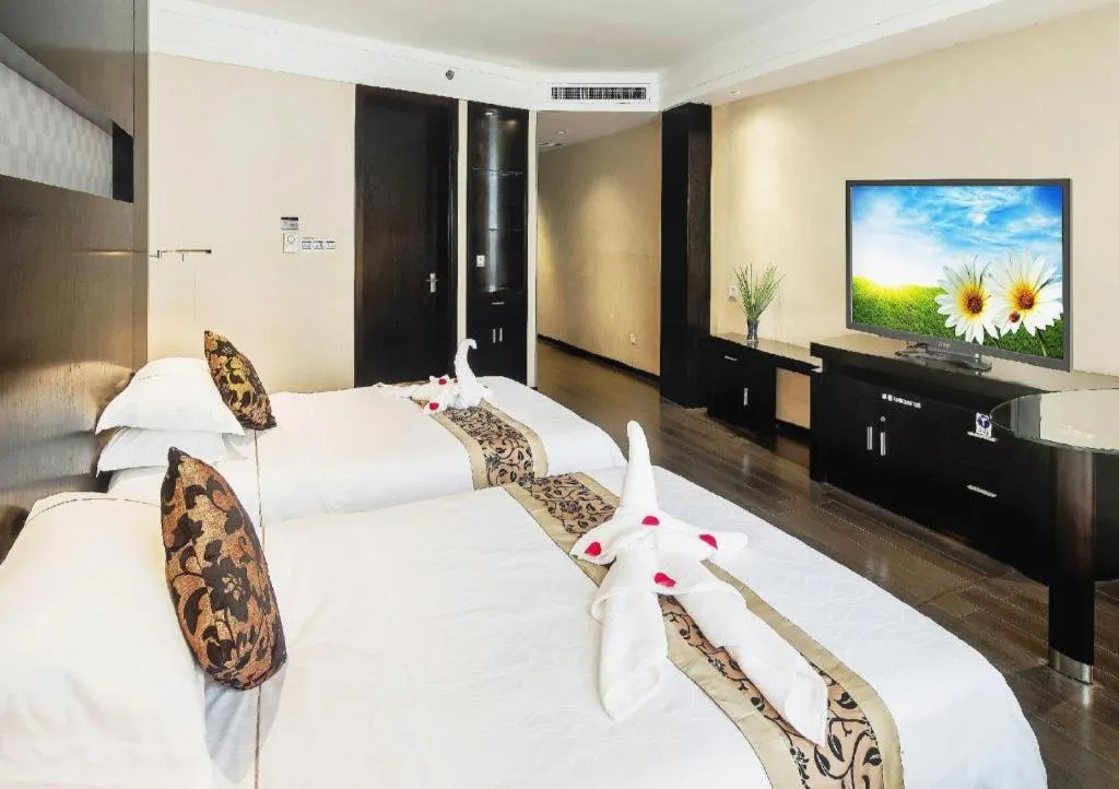 Bed in Guangdong Nanmei Osotto Hotel