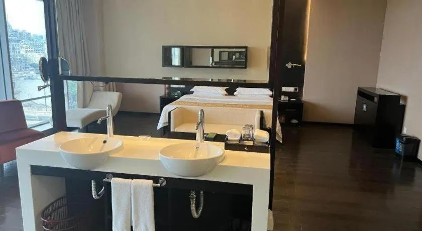 Bed in Guangdong Nanmei Osotto Hotel